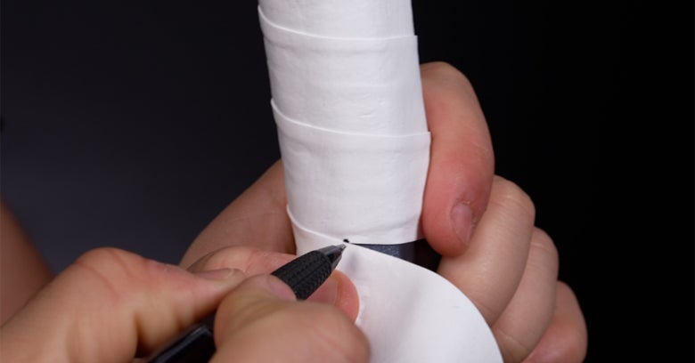 Making the second cut mark on the overgrip